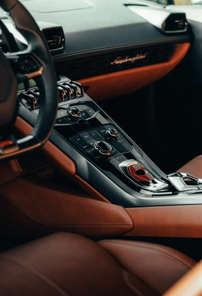 A close up of the steering wheel and dashboard in a car