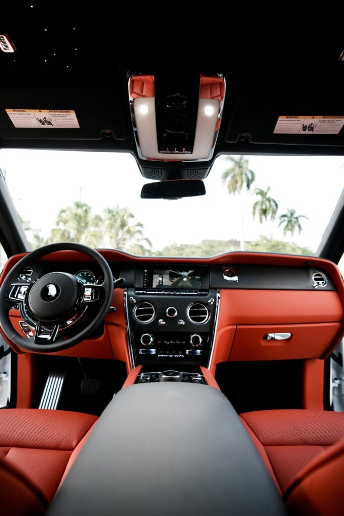 A car with red leather interior and dashboard.